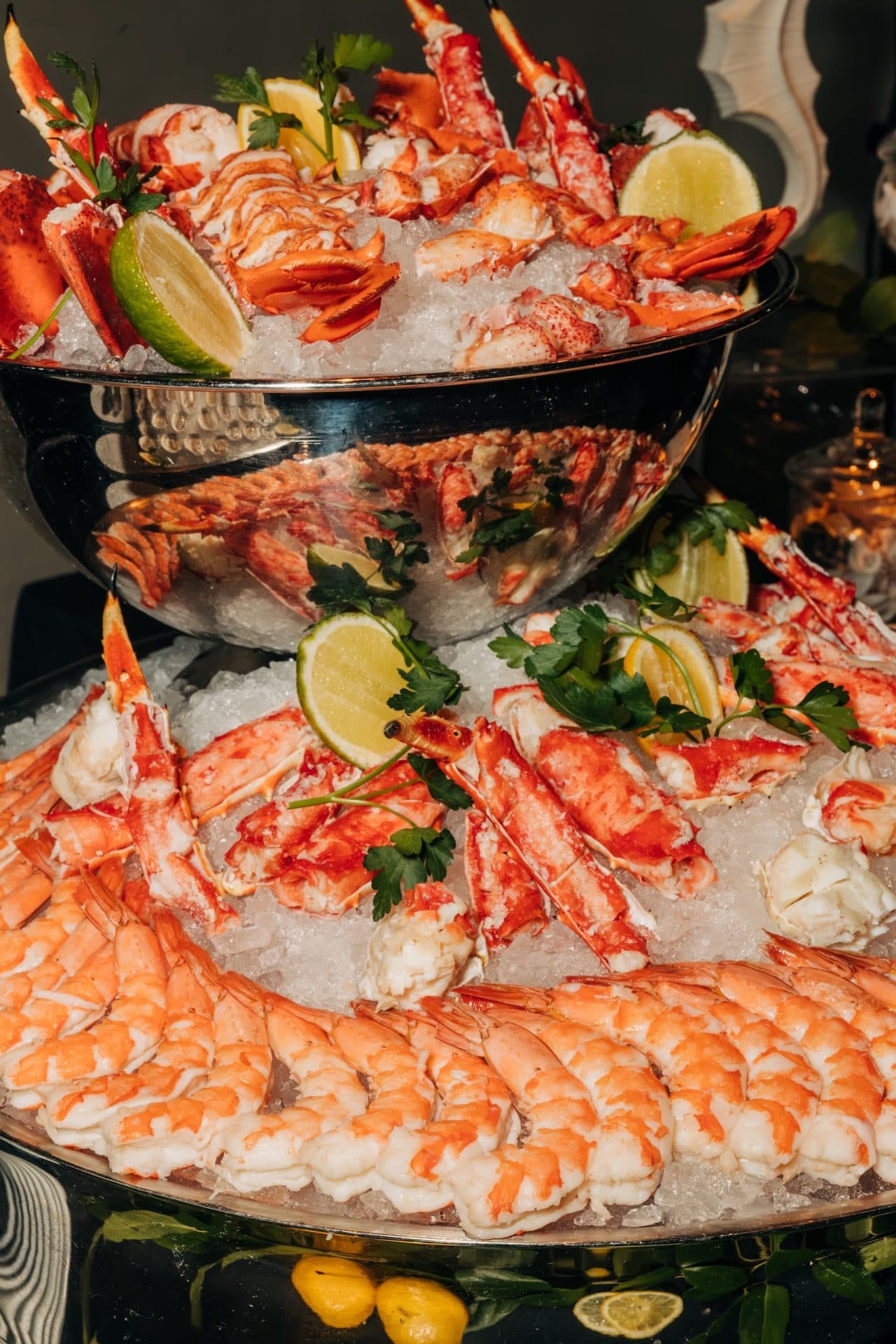 King Crab legs and lobster tails on ice in silver bowls at the Meta Apex Center, a premier Las Vegas event venue